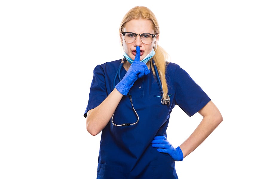 Angry Medical Intern Or Surgeon In Blue Scrubs, Gloves And Face
